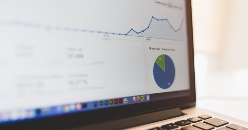 A laptop displaying 8 Ways to Rank Poorly on Google with a pie chart.