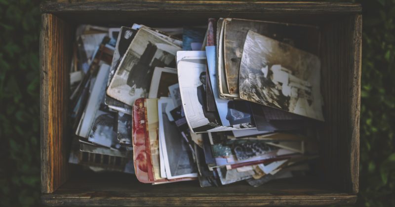 A box containing vintage photographs.