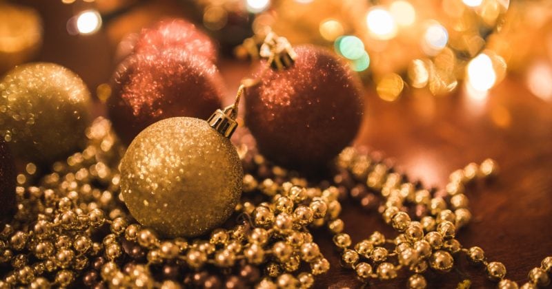 Christmas ornaments and lights on a table.