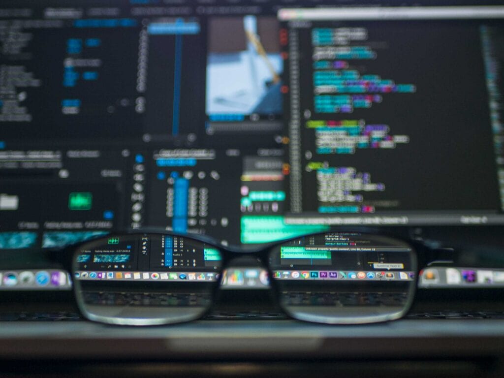 A pair of glasses sitting on top of a computer screen, representing website design.