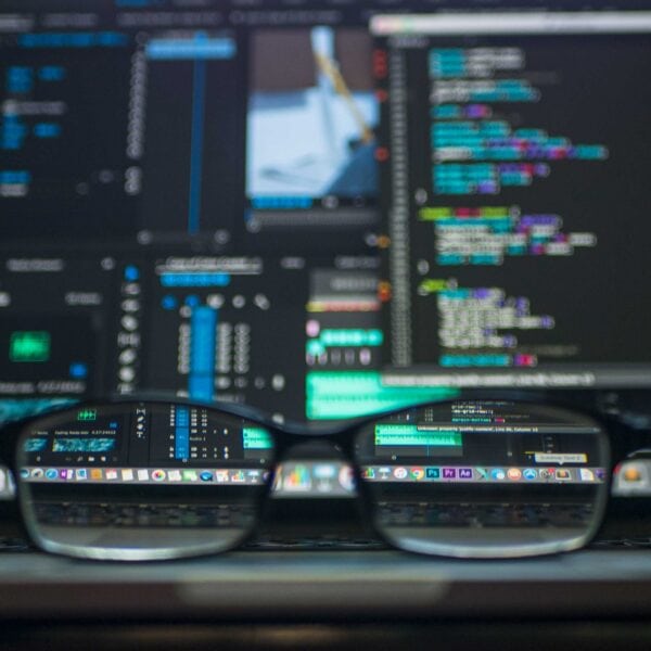 A pair of glasses sitting on top of a computer screen, representing website design.