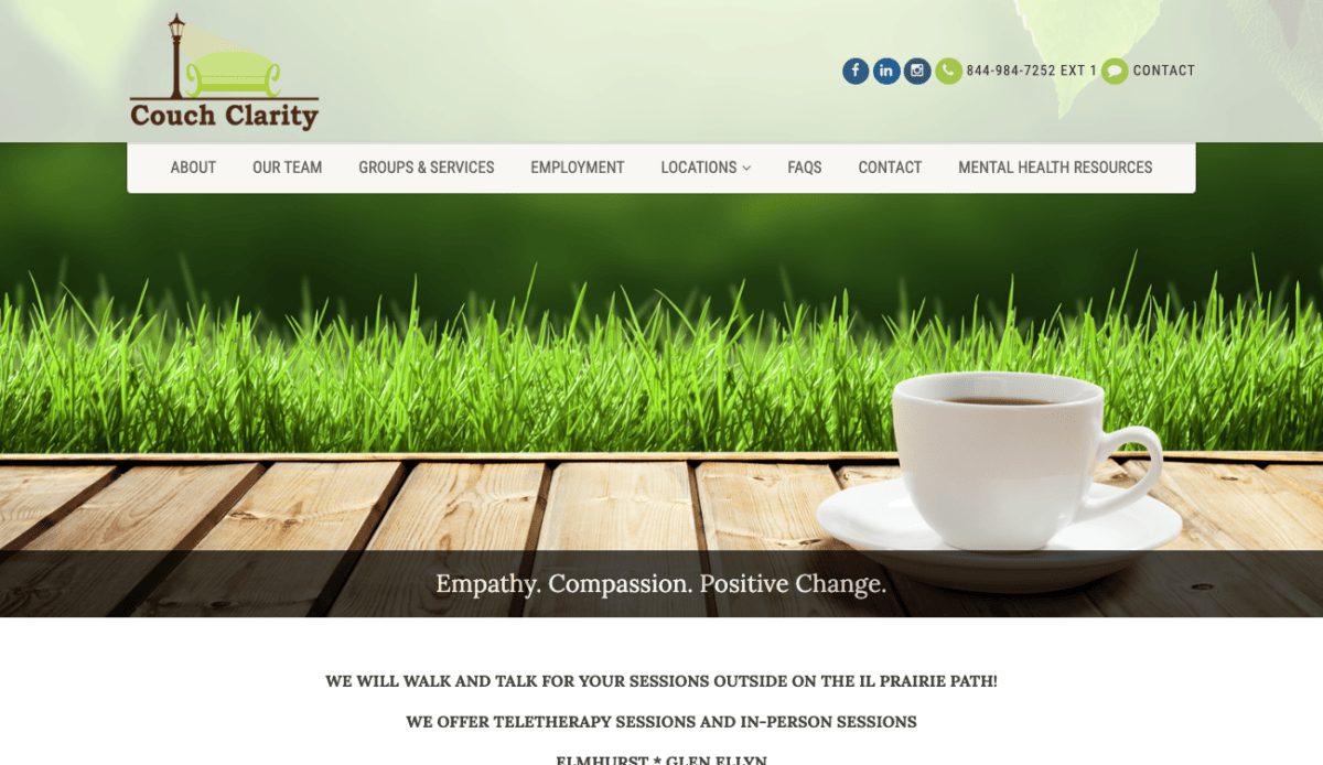 A website design featuring a cup of coffee on a wooden table for ultimate couch clarity.