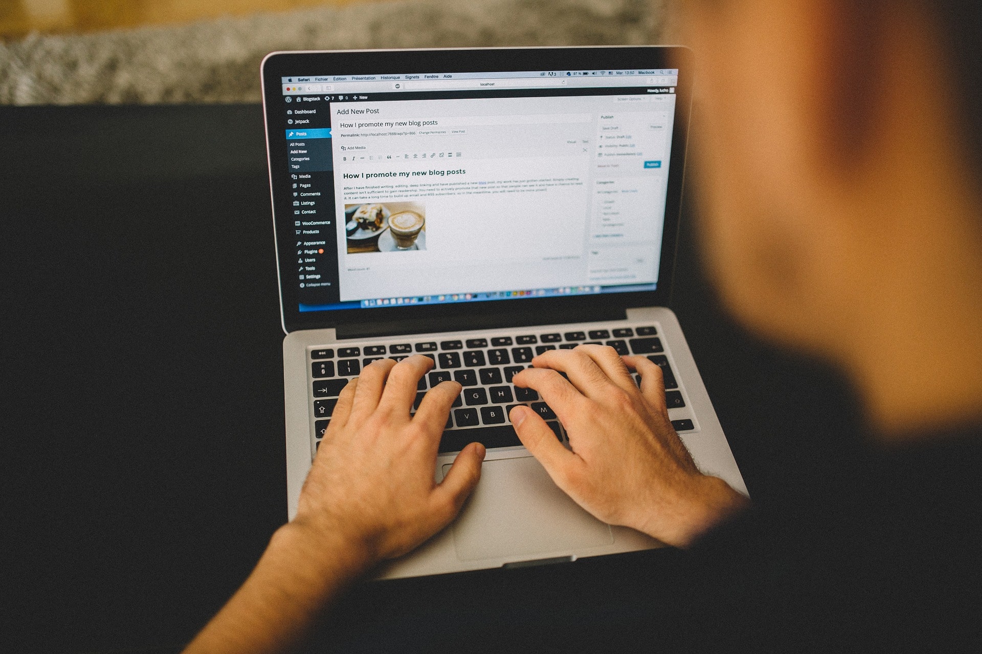 A person typing on a laptop computer.