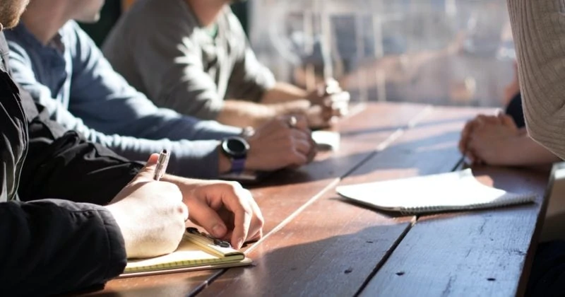 A group of people sitting around a table creating opportunities.