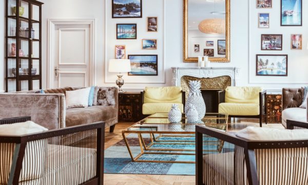 A stylish living room featuring a carefully curated arrangement of couches, chairs, and a coffee table showcasing impeccable interior design.