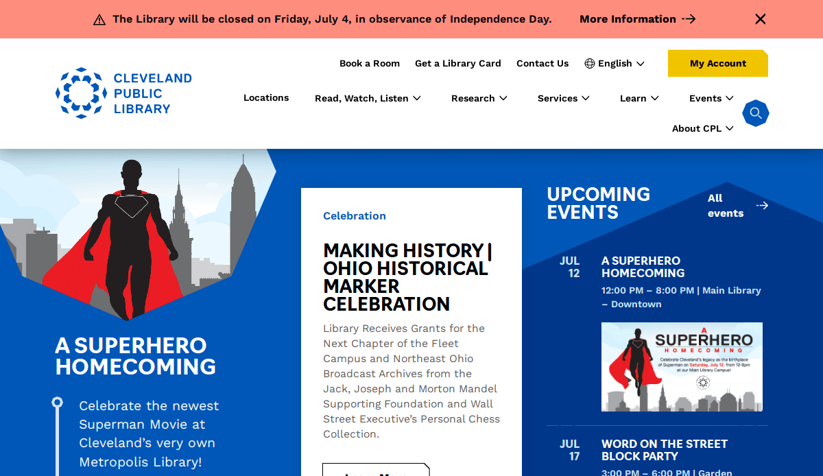 Screenshot of the Cleveland Public Library website, showcasing a banner about a holiday closure and upcoming events. A standout among the best library websites, its design highlights “A Superhero Homecoming” and the Ohio Historical Marker Celebration.