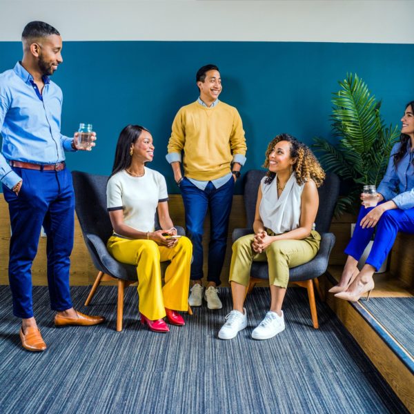 A group of business coaches sitting together in an office.