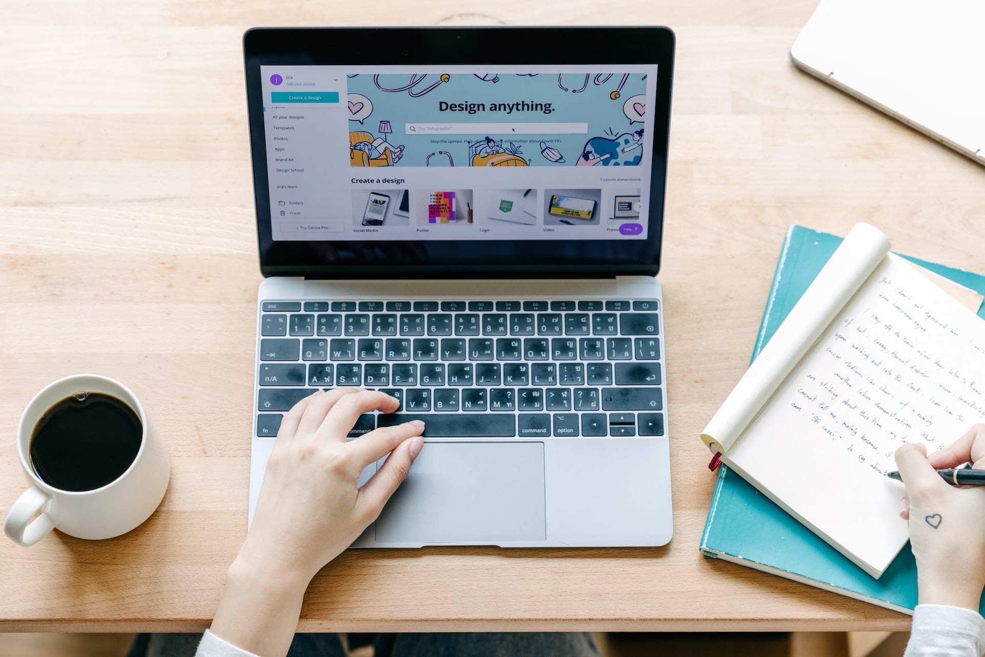 A woman multitasking on a Strategically Sound Website, typing on a laptop with a cup of coffee by her side.