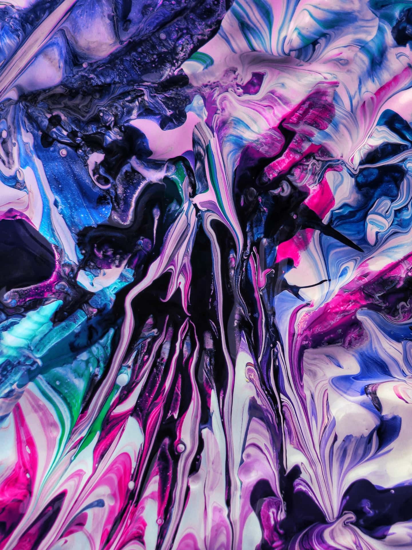 A close up of a liquid with purple, blue, and pink hues, exploring the impact of color psychology.