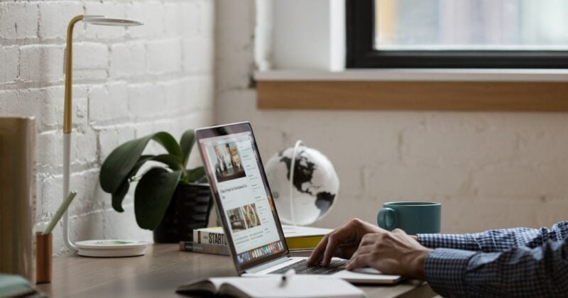 A man utilizing a laptop to create captivating content.