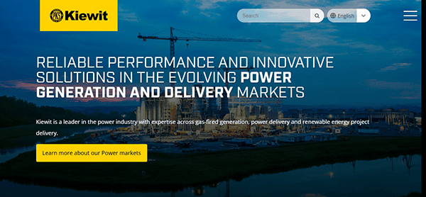 Kiewit's homepage, set against a construction site backdrop, showcases their prowess in power generation and delivery. As one of the top construction websites, it features a user-friendly navigation menu and search bar prominently at the top.