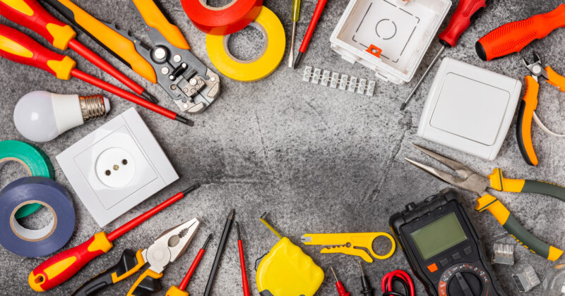Various electrical tools are arranged in a circular pattern.