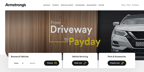 Armstrong’s website homepage stands out among the best auto repair websites, letting you browse vehicles, book servicing, or enquire about parts and accessories—all with a sleek car partially visible on the right.