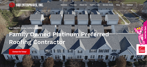 Aerial view of townhouses with a banner for S&D Enterprises, Inc., a family-owned platinum preferred roofing contractor. Known as the best in roofing, they've expertly roofed over 500,000 homes since 1963, showcasing their legacy on top-rated roofing websites.