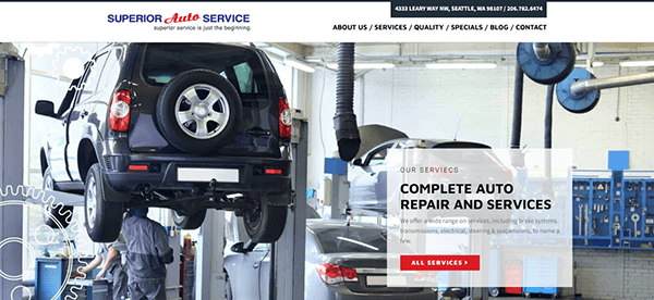 A mechanic works on an SUV lifted on a car hoist inside a well-lit auto repair shop, showcasing the kind of professional workspace often featured on the best auto repair websites.
