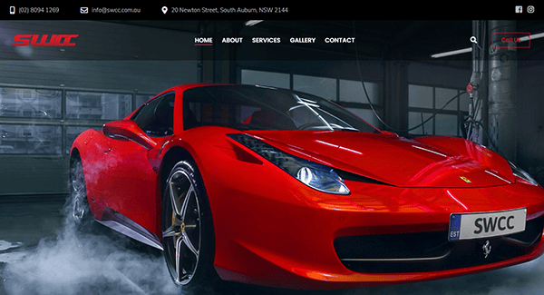 A red sports car with a SWCC license plate is parked in a garage, showcased on an auto repair website header, reflecting the best auto repair services available.