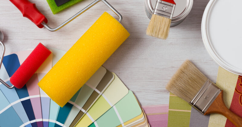 A paint roller and paint brush, providing the tools needed for a flawless painting job.