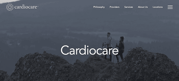Two people standing on a mountain peak with the word "cardiocare" displayed in the center.