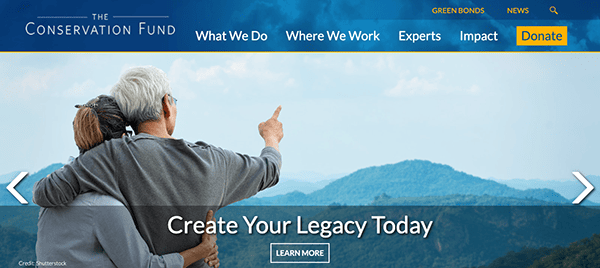 An older couple embracing while overlooking a scenic landscape, with the slogan "create your legacy today" for an environmental conservation organization.
