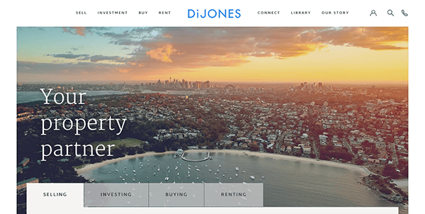 Real estate company website homepage with an aerial view of a cityscape during sunset, highlighting property services.