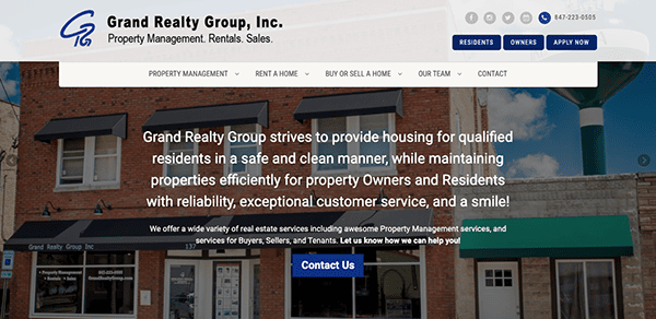 A website homepage for grand realty group, inc. featuring their commitment to providing safe and clean housing with exceptional customer service.
