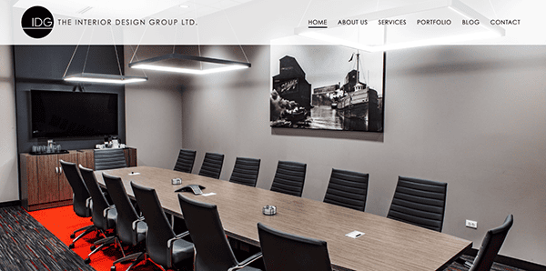 A conference room with a large table and chairs.