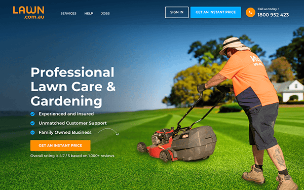 A lawn care website with a man mowing the lawn.