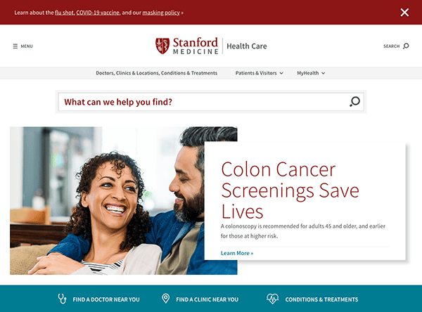 A couple smiling and looking at each other on a healthcare website page promoting colon cancer screenings.