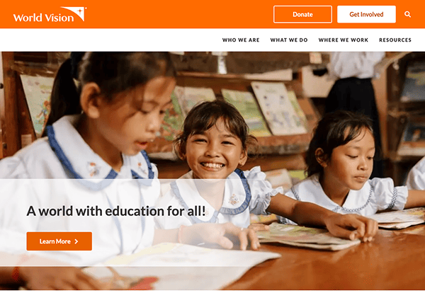 Young students in uniforms smiling and studying in a classroom environment.