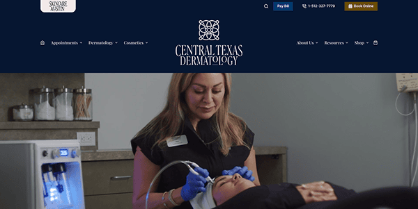 A dermatologist performing a facial treatment on a patient in a clinical setting, with medical equipment and branding for central texas dermatology visible.