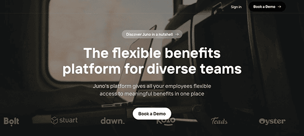 Website homepage banner with text "the flexible benefits platform for diverse teams" and a blurred train window background.