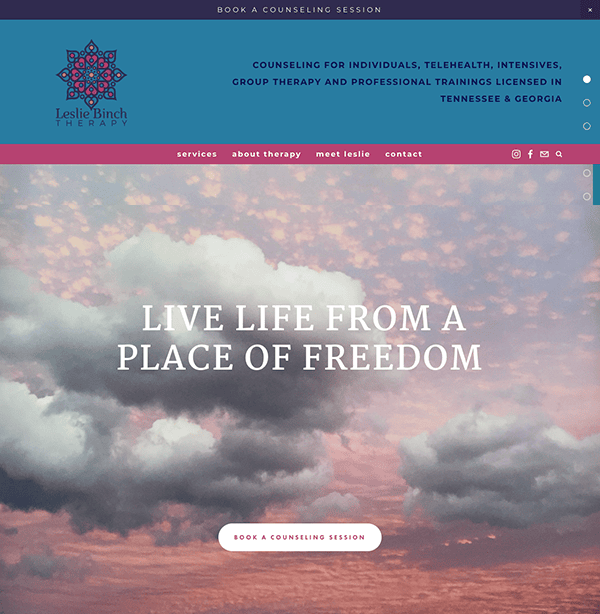 Homepage of a therapy website featuring a serene sky with clouds, including navigation links and a central motivational message, "live life from a place of freedom".