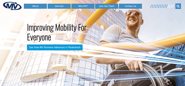 Man in wheelchair smiling with sunlit modern cityscape in the background, overlaid with colorful motion lines, on a mobility services website.