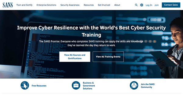 Website homepage of a cybersecurity company featuring a woman using a tablet, with options to view courses and training events, and links for further resources and contact information.