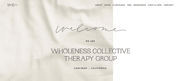 Homepage screenshot of the wholeness collective therapy group website featuring a "welcome" message on a subtle white fabric background with site navigation links.