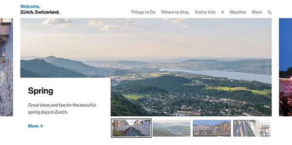 Panoramic view of zurich, switzerland, showcasing the cityscape with a sprawling landscape and distant hills under a clear sky.