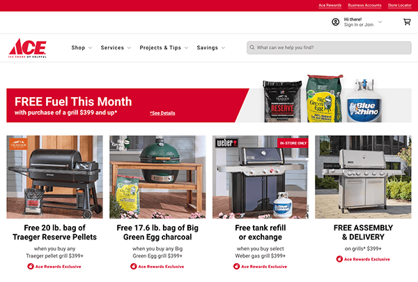 Screenshot of ace hardware's online store homepage featuring promotions on grills, charcoal, and other outdoor items with a graphical red and green layout.