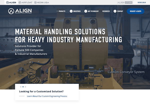 Website homepage for align production systems, featuring a background image of industrial heavy machinery, with text about heavy industry manufacturing solutions.