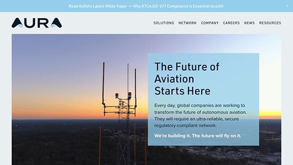 Website homepage for an aviation company featuring a dusk sky backdrop with the silhouette of a communications tower and an overlay text about the future of aviation.