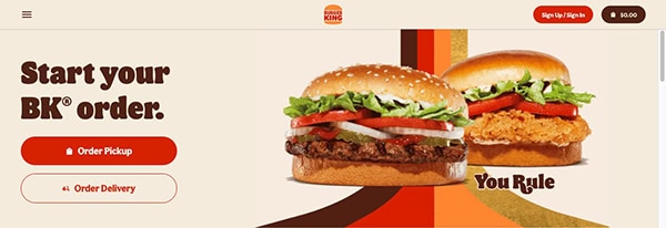 Burger king website homepage featuring an ad to "start your bk order" with images of two burgers, and options for pickup or delivery.