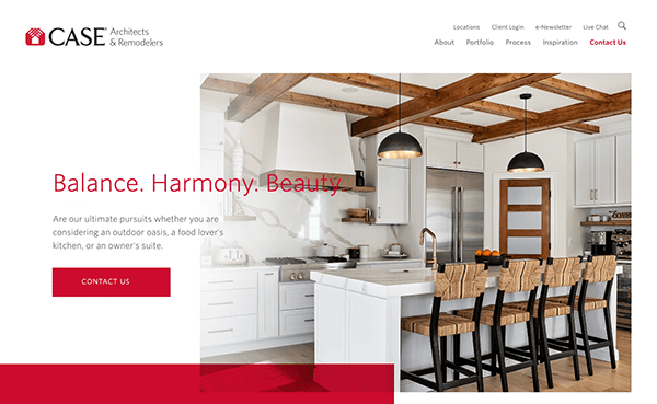 Modern kitchen featuring a large island with wooden stools, white cabinets, stainless steel appliances, and wooden ceiling beams. A text overlay reads, "Balance. Harmony. Beauty.