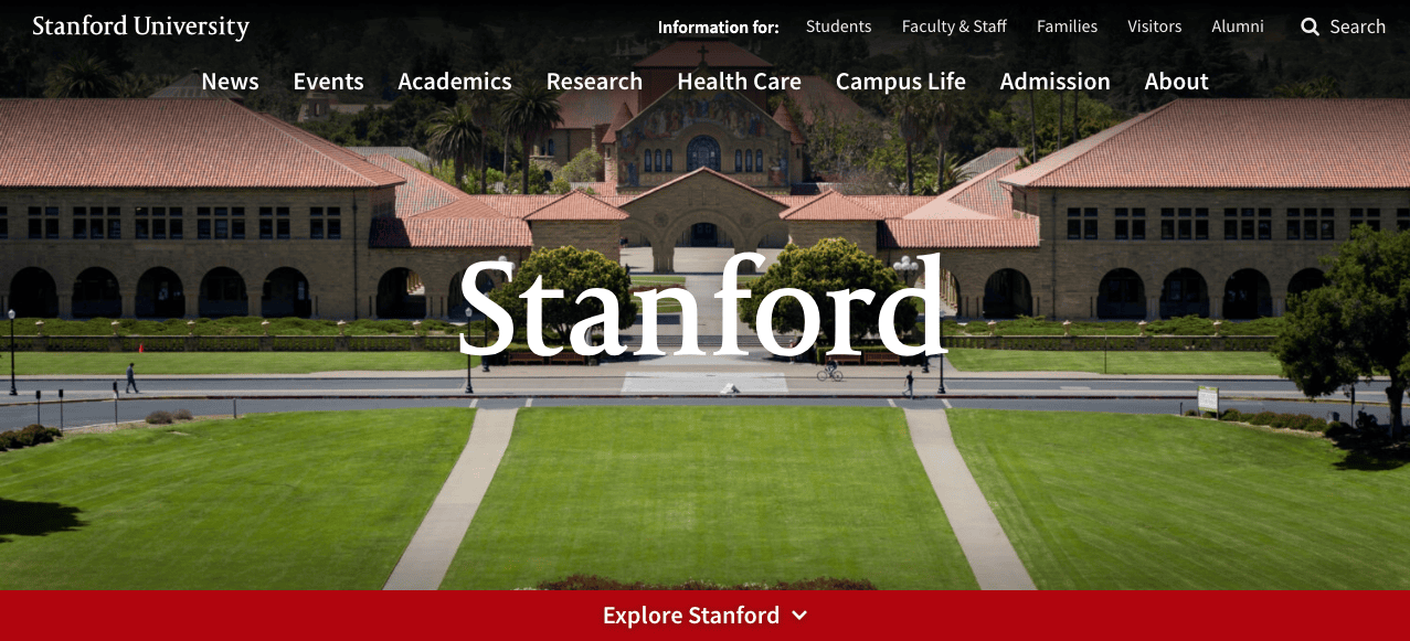 View of stanford university's main quad with lush green lawns and historic sandstone buildings, featuring the university's name overlaid in white text.
