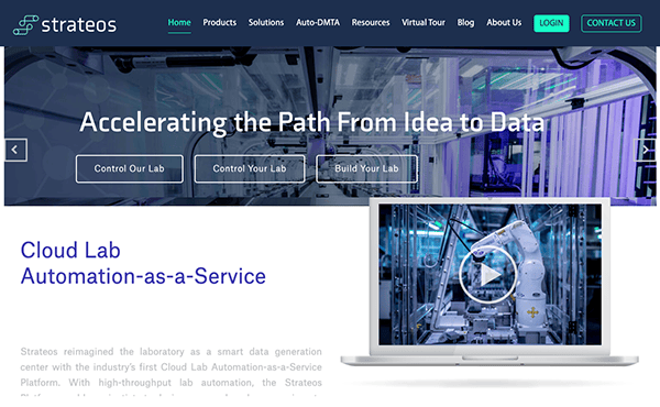 Homepage of a technology company's website featuring cloud lab automation services, with a large image of a high-tech lab on a laptop screen.