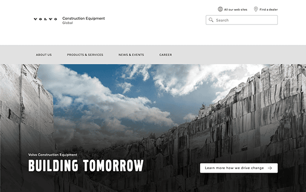 Screenshot of the volvo construction equipment website’s homepage featuring a large header image of a rock quarry with the tagline "building tomorrow.