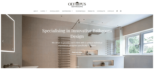 A modern bathroom with a large window, towel warmer, and glass shower. Text overlay reads "Specialising in Innovative Bathroom Design" with the "Olympus Bathrooms" logo at the top.