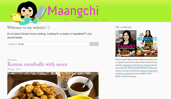 Screenshot of Maangchi's website featuring Korean meatballs with sauce. The navigation bar includes options like "Home," "Recipes," and "About." The right column shows Maangchi's cookbooks.