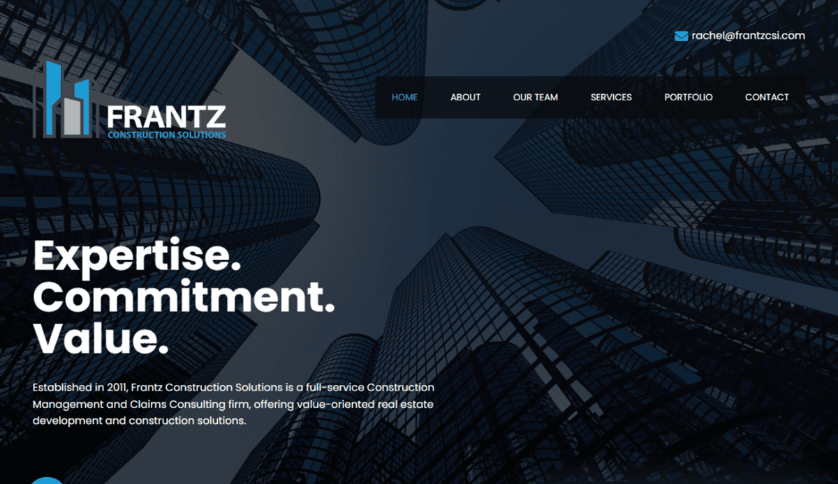 Screenshot of a construction company's website homepage featuring sections on services, projects, company information, and contact details. The design includes images of construction sites and buildings.