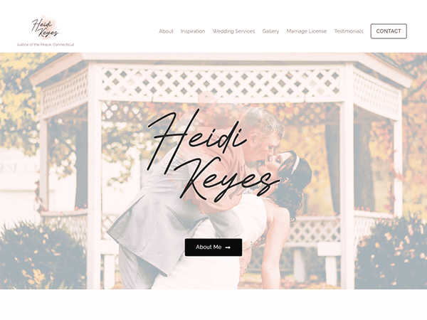 A couple shares a kiss in front of a white gazebo. The website header reads "Heidi Keyes," with menu options like About, Wedding Services, and a Contact button.