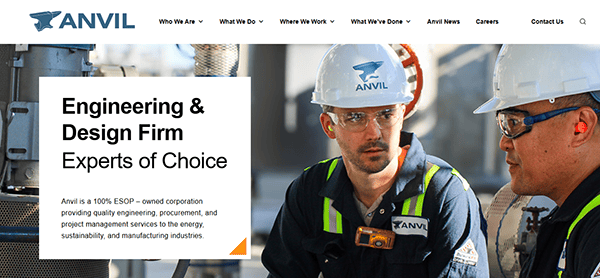 Two workers in safety gear at an industrial site, highlighting Anvil's expertise as an engineering and design firm specializing in various industries. Discover how we collaborate with the best commercial electricians to ensure top-notch quality and safety.