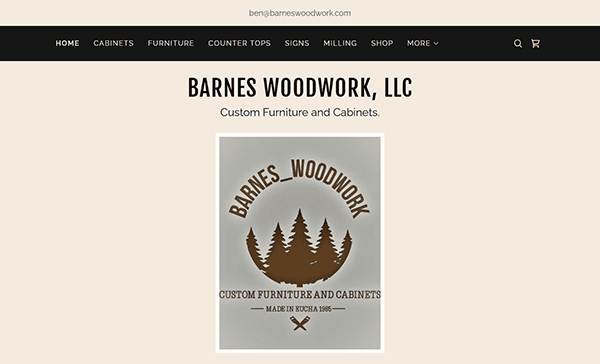 Barnes Woodwork, LLC's homepage showcases their logo adorned with trees alongside the words "Custom Furniture and Cabinets," exemplifying one of the best carpenter websites for tailored craftsmanship.